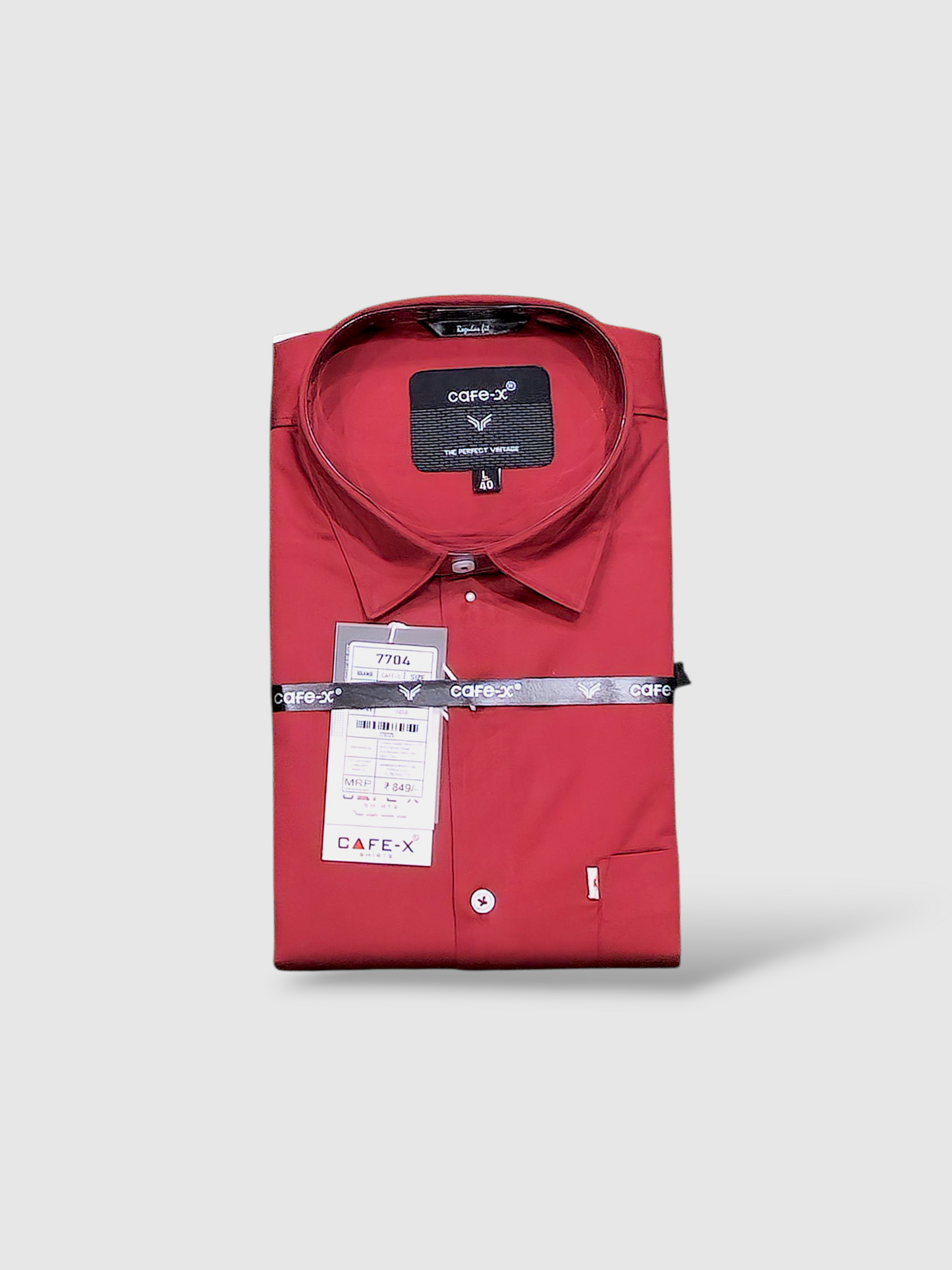 Red shirt with a cafe-x brand label on a light gray background