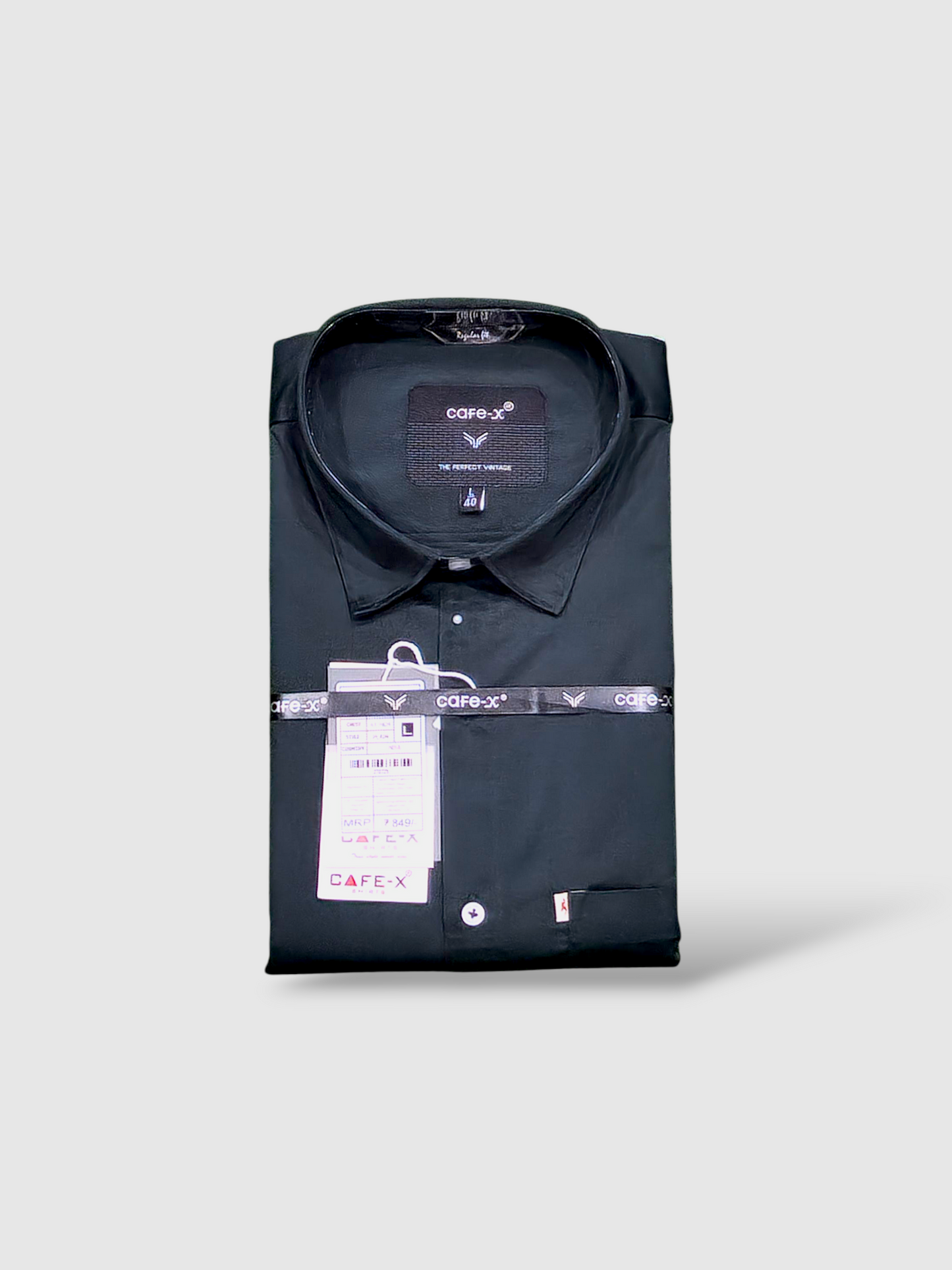 Folded bottle green colour shirt with a tag on a light gray background
