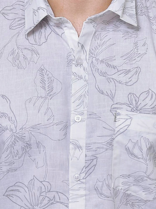 Close-up of a white colour shirt with floral print