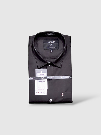 Folded black shirt with a cafe-x label on a light gray background