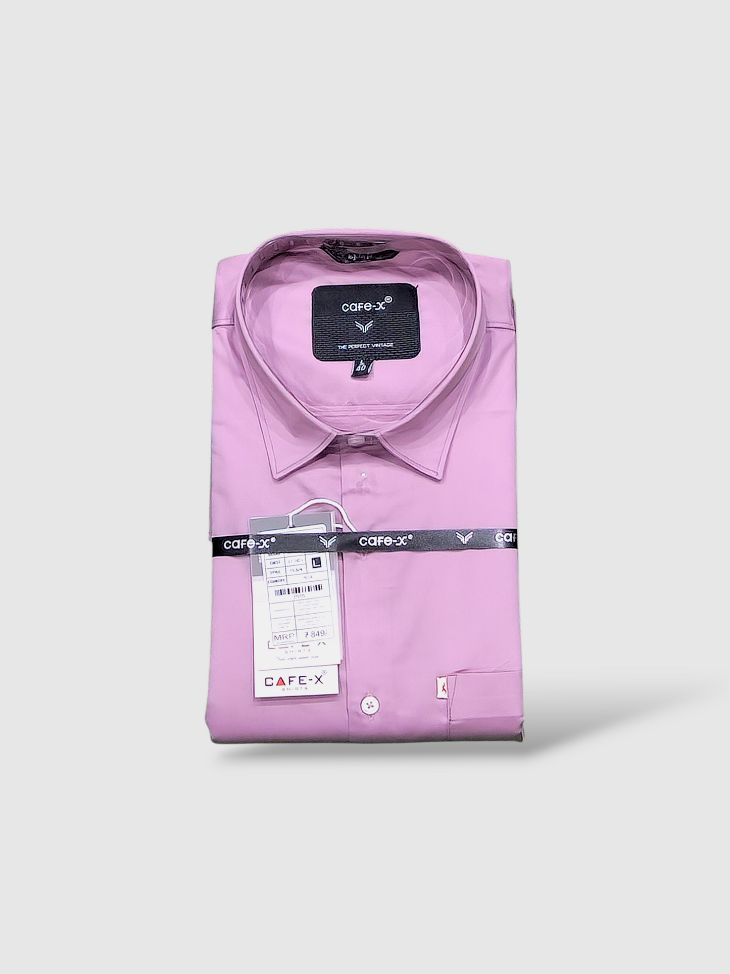 Folded dusty pink shirt with Cafe-X label on a white background