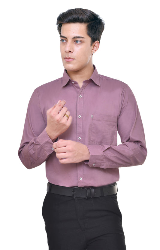 Man wearing a purple shirt and black pants on a white background