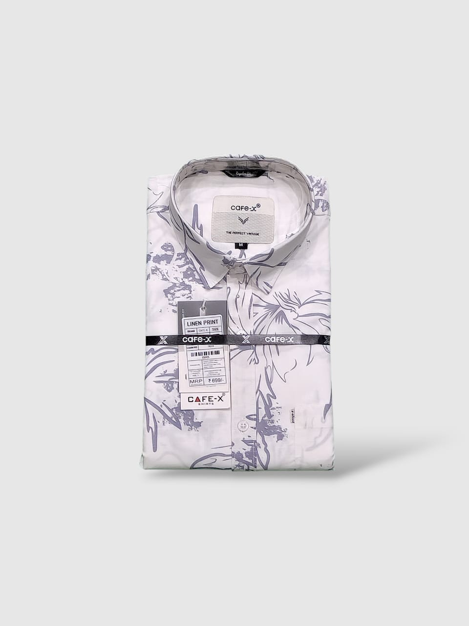 Floral-patterned shirt with Cafe X label on a white background