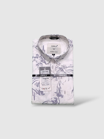 Floral-patterned shirt with Cafe X label on a white background