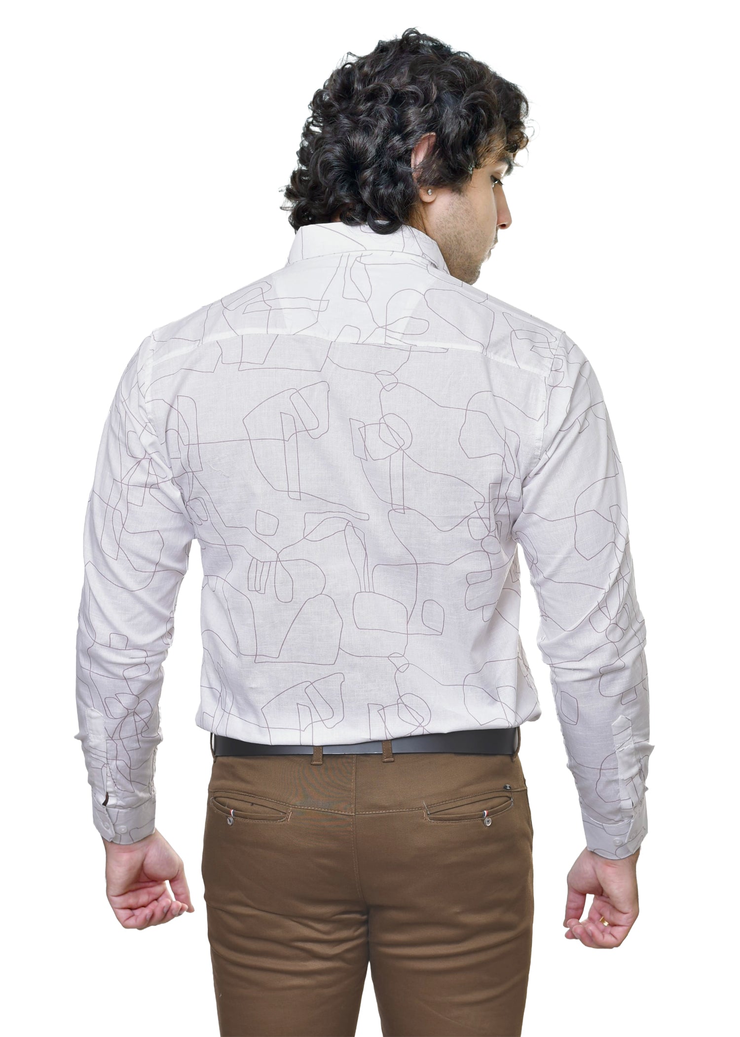 Man wearing a white patterned shirt and brown pants on a white background