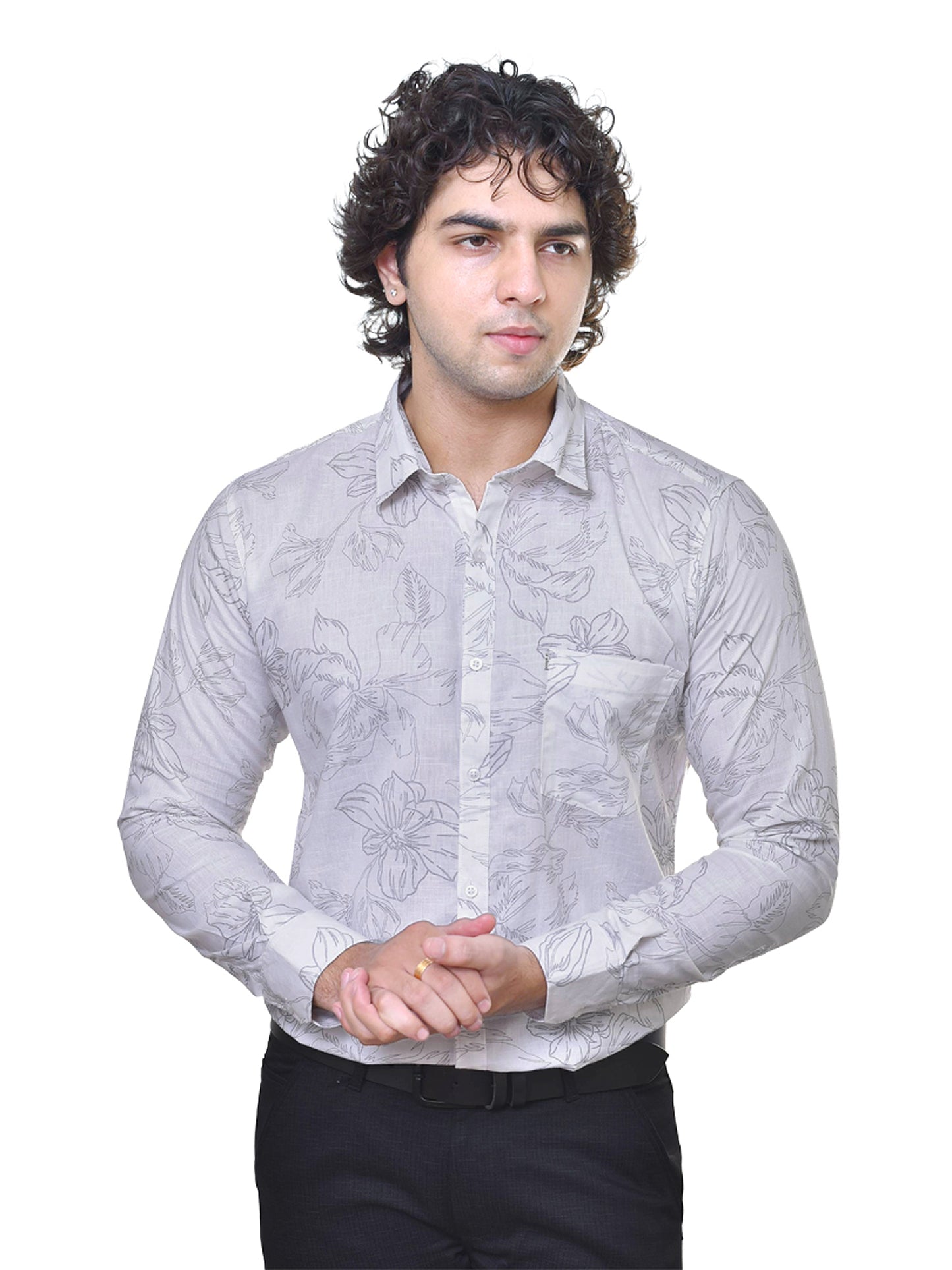 Man wearing a whitepatterned shirt on a white background