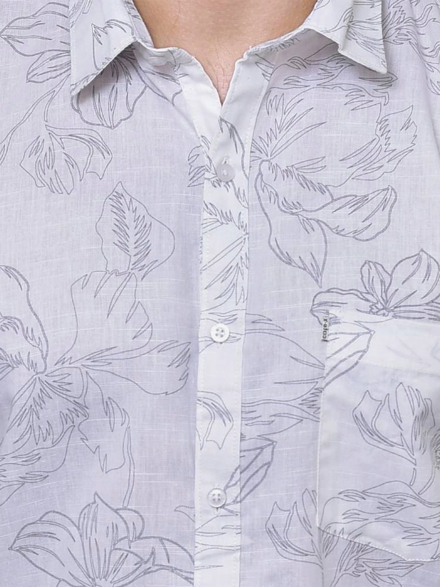 Close-up of a white colour shirt with floral print