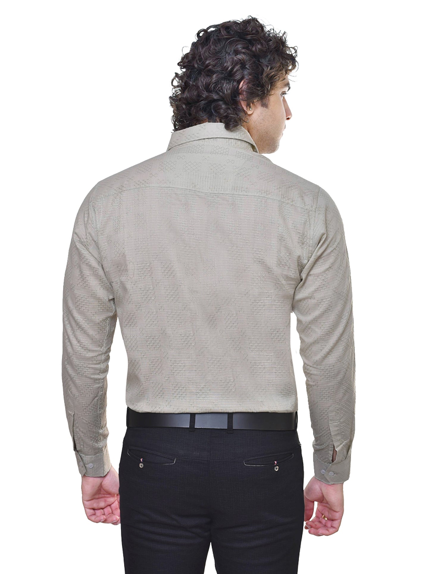 Man wearing a sage green dobby shirt and black pants on a white background