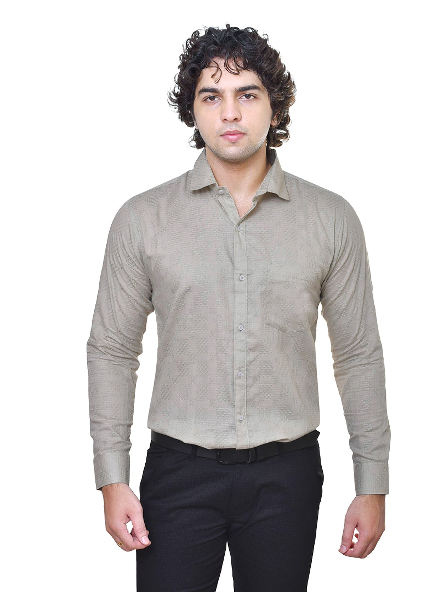Man wearing a sage green shirt and black pants on a white background